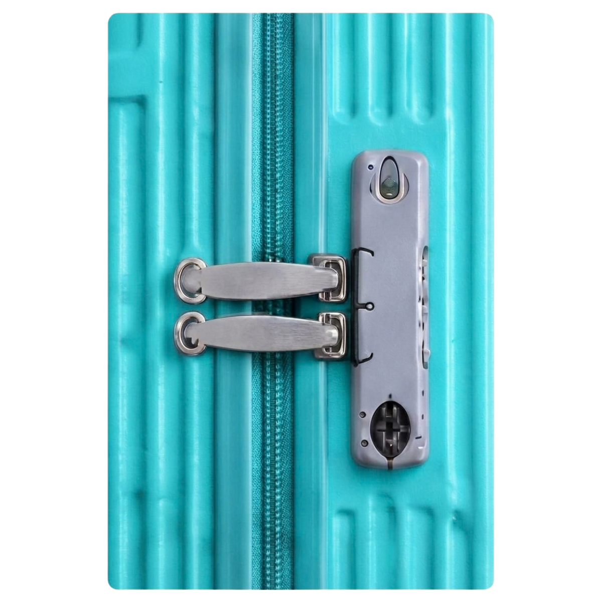 Close-up of a turquoise ribbed hard-shell suitcase with a silver zipper and a matching silver zipper pull, shown against a white background.